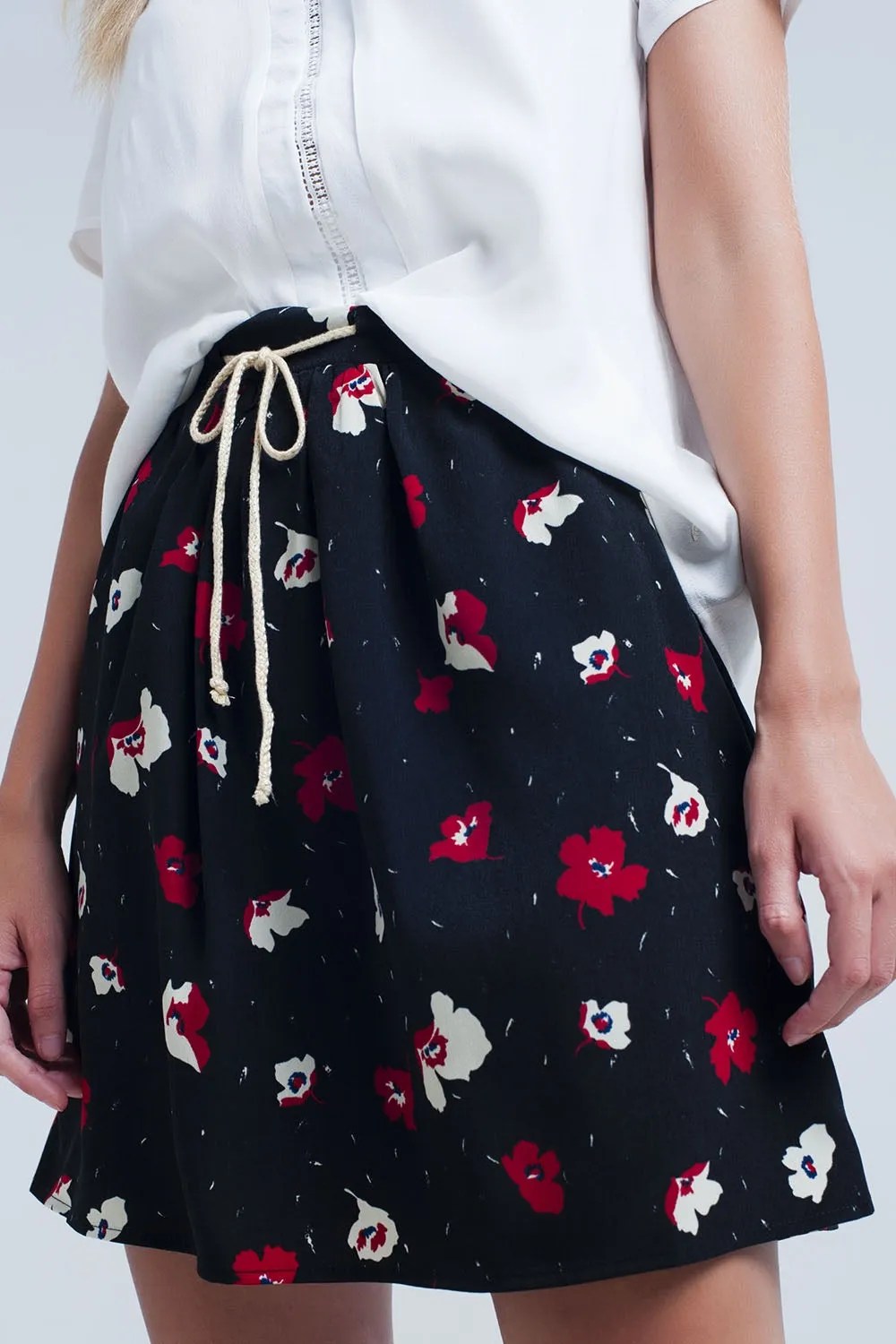 Black mini skirt with floral pattern